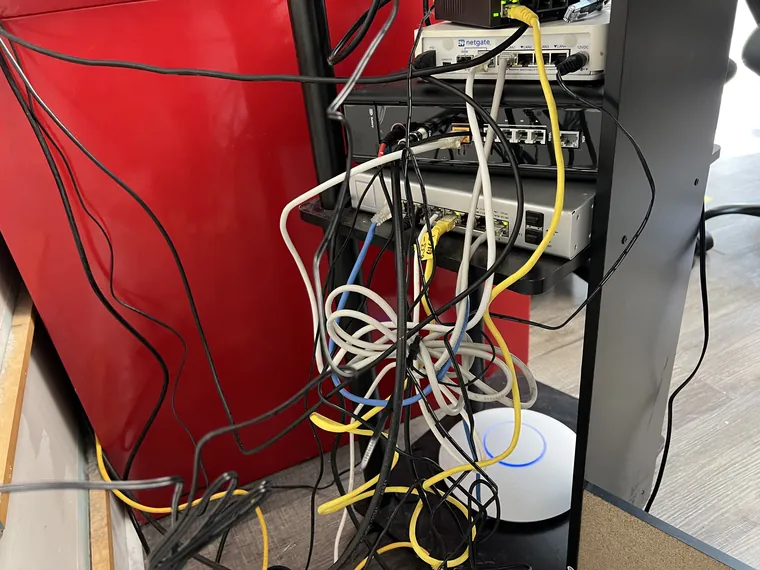 Messy network cabling before cleanup, another angle