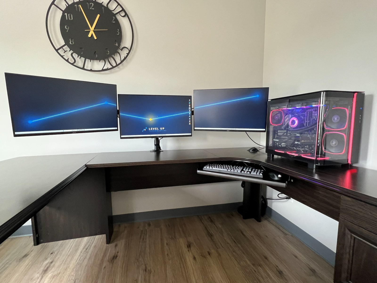 Deployed at the client desk across three displays, in service and working.